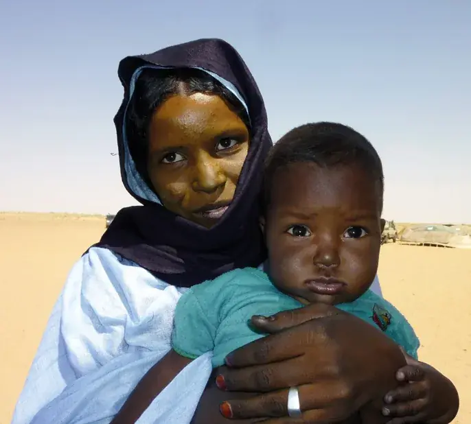 Tuareg mother holding her child in her arms in the Agadez region